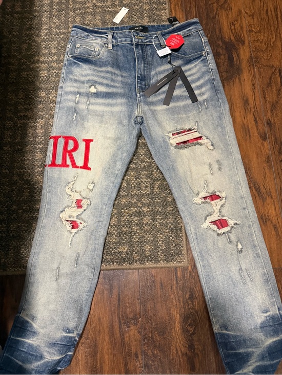 AMIRI Other - AMIRI Light Blue Distressed Jeans with Red Patch Details